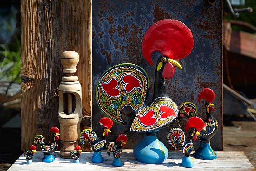 Photo of a collection of rooster sculptures